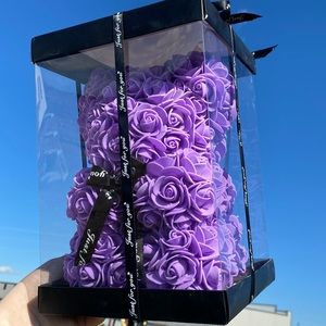 Purple Valentine flower bear. Has the extra petals and is 10x7 inches in size.